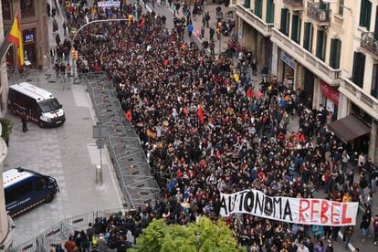 University students and professors march during a demonstration against cuts and academic fees.