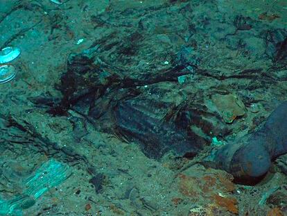This 2004 photo provided by the Institute for Exploration, Center for Archaeological Oceanography/University of Rhode Island/NOAA Office of Ocean Exploration, shows the remains of a coat and boots in the mud on the sea bed near the Titanic's stern.