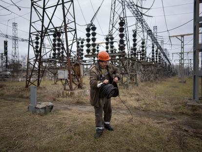 A worker repairs damage from Russian shelling at a power station in central Ukraine on January 5.