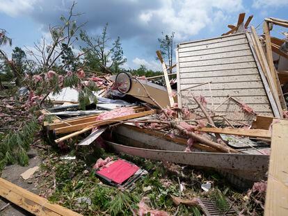 Debris litters a home following a Sunday night tornado that swept through Louin, Miss., Monday, June 19, 2023.  (AP Photo/Rogelio V. Solis)