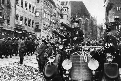 Adolf Hitler marching through the Bavarian city of Nuremberg in 1927.