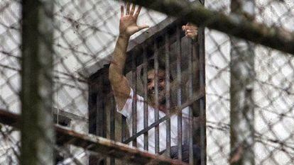 Leopoldo L&oacute;pez greets a crowd from a window at the military prison Ramo Verde in Caracas. 