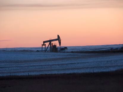 A pump jack for pulling oil from the ground is seen near New Town, N.D., Feb. 25, 2015. On Monday, March 27, 2023