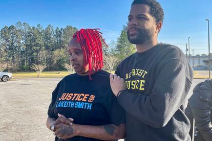 Daniel Forkkio, left, of the advocacy group Represent Justice, comforts Brontina Smith on Tuesday, March 21, 2023, outside the courthouse in Wetumpka, Ala., after a judge reduced her sons's prison sentence down to 30 years from 50 for a killing he did not commit.