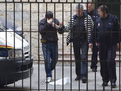 Ra&uacute;l Conejero hides his face as he arrives at court in Alicante earlier this year.