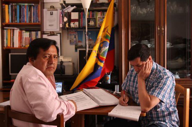 Galo Chiguano (l) and José Izurrieta revise for the exam that they hope will take them home to Ecuador.