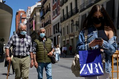 Pedestrians wearing face masks near Madrid‘s Puerta del Sol square.