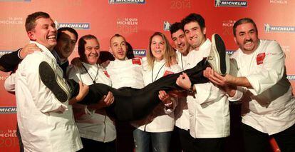 David Mu&ntilde;oz (c) is held aloft by other winning chefs in Bilbao.