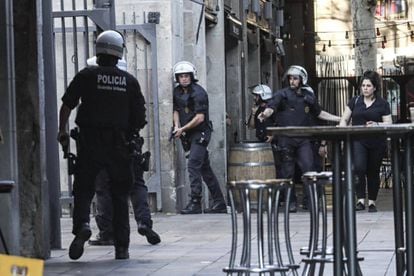 Police clear central Barcelona on Thursday afternoon.