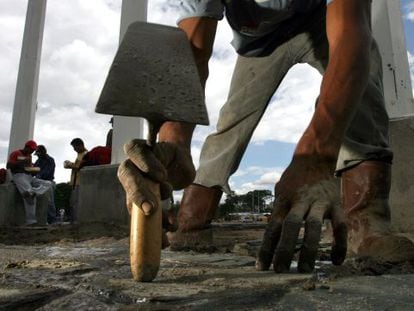 A laborer works outside the Cahamay stadiium in Puerto Ordaz, Venezuela. 