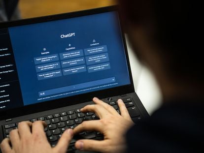 A person uses the text software ChatGPT, created by the OpenAI company in Hesse, Germany.