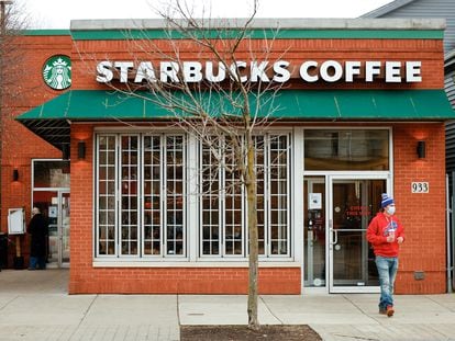 A customer exits a Starbucks in Buffalo, New York, U.S., December 7, 2021.