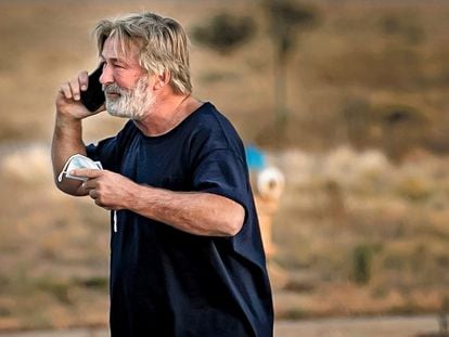 Alec Baldwin speaks on the phone in the parking lot outside the Santa Fe County Sheriff's Office in Santa Fe, N.M., after he was questioned about a shooting on the set of the film "Rust" on the outskirts of Santa Fe, Thursday, Oct. 21, 2021.
