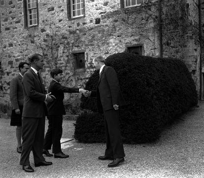 Charles, then Prince of Wales, and his father, Duke of Edinburgh, are greeted by the headmaster of Gordonstoun School in Scotland in 1962.