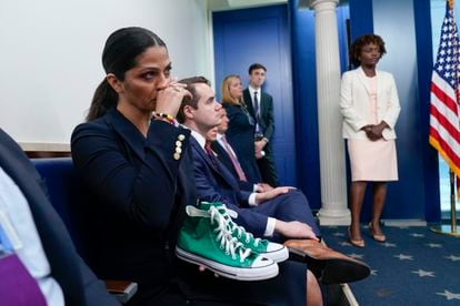 Camila Alves McConaughey listens to her husband while holding sneakers that belonged to the late Maite Yuleana Rodríguez, 10.