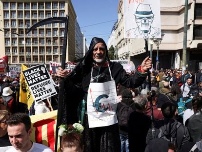 Protesters take part in a demonstration following the fatal collision of two trains, near the city of Larissa, in Athens, Greece, on March 8, 2023.