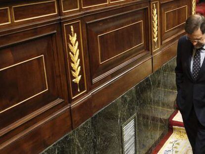 Prime Minister Mariano Rajoy leaves parliament Thursday after casting his vote for the austerity package.