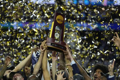 Connecticut Huskies players celebrate after defeating the San Diego State Aztecs in the national championship game of the 2023 NCAA Tournament at NRG Stadium, on April 3, 2023.