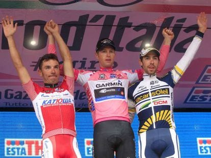 Giro winner Ryder Hesjedal of Canada (C), second-placed Joaquim Rodriguez of Spain (L) and Thomas De Gendt of Belgium (R) celebrate on the podium.
