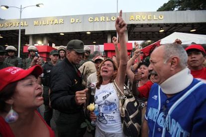 Supporters of Venezuela&#039;s President Hugo Ch&aacute;vez react to the news of his death.