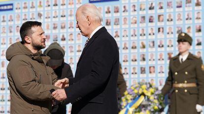 US President Joe Biden (R) is greeted by Ukrainian President Volodymyr Zelenskiy during a visit in Kyiv on February 20, 2023.