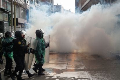 Riot police clash with anti-government protesters in Puno, Peru.