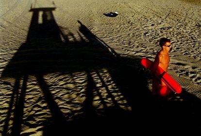 A lifeguard patrols Newport Beach in California.