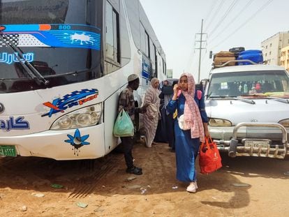 Sudanese civilians wait to board a bus out of Khartoum on Monday.