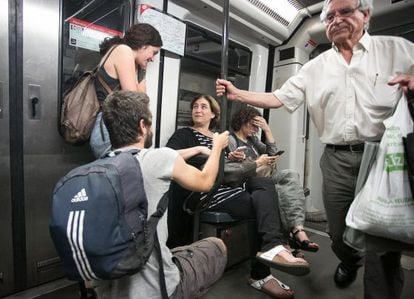 The new mayor of Barcelona, Ada Colau, takes the subway on Monday.