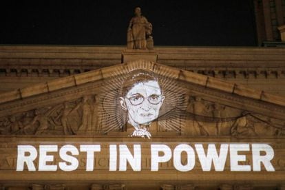 An image of Ruth Bader Ginsburg projected onto the New York State Civil Supreme Court building in Manhattan, New York City.