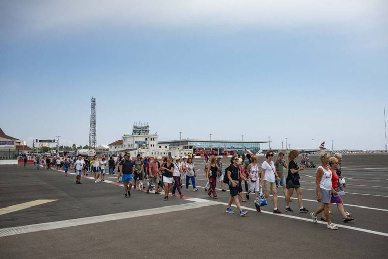 Visitors cross the airport of Gibraltar.