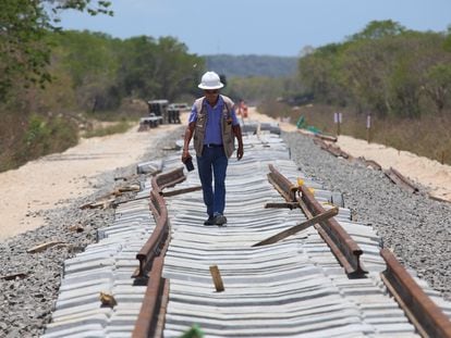 An engineer walks along the Tren Maya tracks in Yucatan.