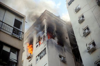 A Tel Aviv building ablaze following rocket attacks from the Gaza Strip.