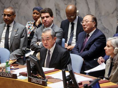Chinese Foreign Minister Wang Yi and UN Security Council Affairs Division (SCAD) Director Claudia Banz attend a UN Council meeting on the conflict between Israel and Hamas, in New York City,  November 29, 2023.