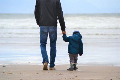 A father and son at the beach.