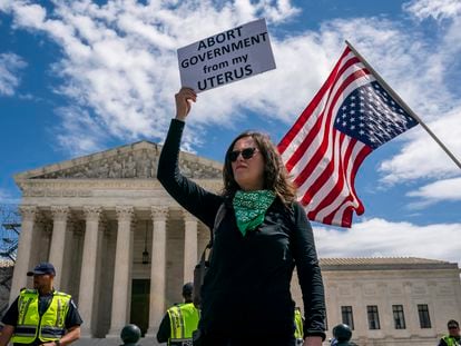 A protester listens to speakers during a Planned Parenthood rally in support of abortion access outside the Supreme Court on Saturday, April. 15, 2023, in Washington.