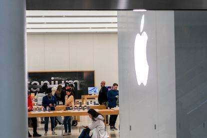 Customers in one of the Apple brand's stores in New York