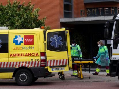 An ambulance taking people out of the Monte Hermoso senior residence in Madrid.