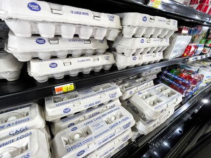 Cartons of fresh eggs line a display case inside a Walmart store in North Reading, Massachusetts, on March 15, 2024.