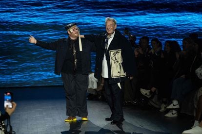Designer Steven Stokey-Daley and actor Ian McKellen greet the audience gathered at the former's show, in which the latter wore the brand’s garments, on February 19, 2023, at London Fashion Week. 
