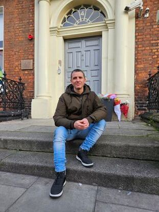 Caio Benicio, who works for the company Deliveroo as a delivery driver. He is pictured in Dublin this past Saturday, in front of the primary school where the stabbings took place.
