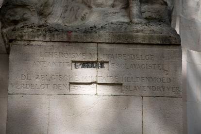 Detail of the monument to the colonizers in the Cinquantenario park, with blood stains.