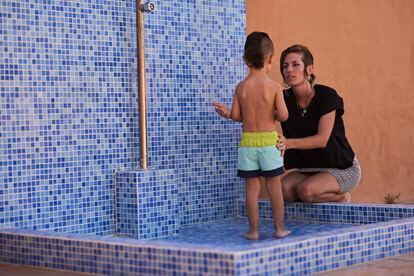 Natalia López, a working mother, with her three-year-old son.