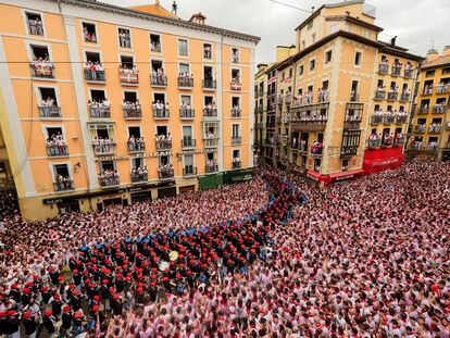 A music band plays in the town hall square after the 'Chupinazo' rocket, to mark the official opening of the 2023 San Fermín fiestas in Pamplona, Spain, 