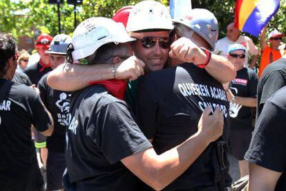 Jubilant miners arrive in Alcobendas, to the north of the capital, on Monday.