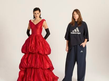 Nine d'Urso poses with Bina Daigeler, the costume designer for the 'Balenciaga' series. The actress wears a reproduction of a ruffled evening dress that Balenciaga showed in 1952. Daigeler wears a Balenciaga x Adidas T-shirt and tracksuit pants, created by Demna Gvasalia, the current creative director of the House of Balenciaga.