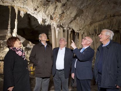 The four men who discovered the cave and the widow of a fifth who died in 2007.