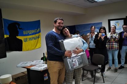 Viktor Tsukanov and a group of municipal employees and volunteers from Berdyansk, a city in the Russian-occupied Zaporizhzhia region, celebrate a birthday at the offices where they help refugees