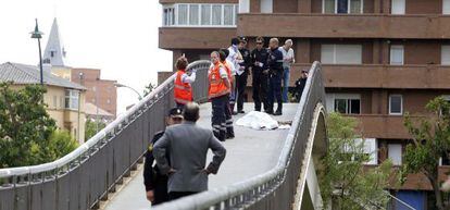 The covered body of politician Isabel Carrasco on a bridge over the Bernesga river in León.