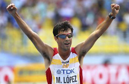 Miguel Ángel López celebrates his third-placed finish in the 20-kilometer walk.